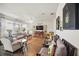 Bright living room with wood floors, comfortable seating, and large windows at 1107 Trappers Trail Loop, Davenport, FL 33896