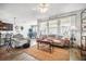 Open concept living room featuring wood flooring and neutral decor at 1107 Trappers Trail Loop, Davenport, FL 33896