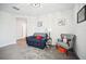 Sitting room with comfortable seating and a variety of decor throughout at 1107 Trappers Trail Loop, Davenport, FL 33896