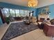 Bright living room with a fireplace, view of backyard and large area rug at 133 La Casa # 133, Lake Wales, FL 33898