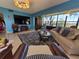 Comfortable living room with a large window offering scenic outdoor views and a classic area rug at 133 La Casa # 133, Lake Wales, FL 33898