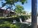 Serene community pool setting with comfortable lounge chairs and professionally maintained landscaping at 133 La Casa # 133, Lake Wales, FL 33898