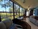 Bright sunroom featuring floor to ceiling windows with a view of the spacious front yard at 133 La Casa # 133, Lake Wales, FL 33898