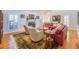 Spacious living room with a fireplace, hardwood floors, and a seating arrangement for entertaining guests at 1444 Pelican Bay Trl, Winter Park, FL 32792