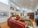 Expansive living room featuring high ceilings, a cozy seating area, and a view of the dining space at 1444 Pelican Bay Trl, Winter Park, FL 32792