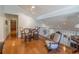 Loft featuring hardwood floors, comfortable seating, and wrought iron railing at 1444 Pelican Bay Trl, Winter Park, FL 32792