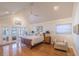 Spacious main bedroom features hardwood floors, high ceilings, a ceiling fan and walk out patio at 1444 Pelican Bay Trl, Winter Park, FL 32792