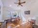 Home office with hardwood floors, natural light, and modern desk setup at 1444 Pelican Bay Trl, Winter Park, FL 32792