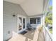 Covered patio features outdoor furniture, offers a tranquil spot for relaxing and enjoying the scenic outdoors at 1444 Pelican Bay Trl, Winter Park, FL 32792