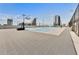Rooftop basketball court featuring cityscape views and modern surfacing, perfect for recreation and enjoying city vistas at 150 E Robinson St # 219, Orlando, FL 32801