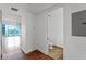 Hallway view of half bath with neutral tile and modern fixtures at 150 E Robinson St # 219, Orlando, FL 32801