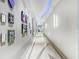 Contemporary hallway featuring modern art displays, sleek lighting, and stylish flooring at 150 E Robinson St # 219, Orlando, FL 32801
