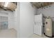 Laundry room with stacked washer and dryer, and utility sink at 150 E Robinson St # 219, Orlando, FL 32801