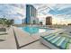 Relaxing rooftop pool with comfortable lounge chairs offering a luxurious outdoor experience with city views at 150 E Robinson St # 219, Orlando, FL 32801