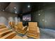 Spacious theater room featuring comfortable reclining chairs and state-of-the-art entertainment system for an immersive experience at 150 E Robinson St # 219, Orlando, FL 32801