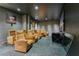 Private theater room featuring plush, recliner seating and a large screen, creating an immersive viewing experience at 150 E Robinson St # 219, Orlando, FL 32801