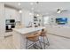 Bright kitchen features a large island, stainless steel appliances, and an open floorplan at 1565 Leaf Ln, Kissimmee, FL 34744