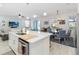 Bright kitchen features a large island, stainless steel appliances, and an open floorplan at 1565 Leaf Ln, Kissimmee, FL 34744