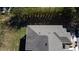 Aerial view of the home's roof and backyard, showcasing the property's layout and surroundings at 17459 Chateau Pine Way, Clermont, FL 34711
