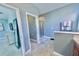 Bathroom featuring double sink vanity with a walk-in glass shower at 17459 Chateau Pine Way, Clermont, FL 34711