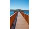 Community dock featuring a wooden gazebo, perfect for relaxing and enjoying waterfront views at 17459 Chateau Pine Way, Clermont, FL 34711