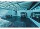 Spacious garage with modern lighting, epoxy floors, plenty of storage, and mirrored wall at 17459 Chateau Pine Way, Clermont, FL 34711