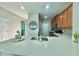 Kitchen with an oversized sink and a breakfast bar that is perfect for entertaining at 17459 Chateau Pine Way, Clermont, FL 34711