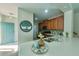 Stylish kitchen features white countertops, wood cabinets, stainless steel appliances, and modern decor at 17459 Chateau Pine Way, Clermont, FL 34711