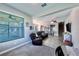 Spacious living area with tile flooring and a view to dining room, kitchen, and staircase in an open floor plan at 17459 Chateau Pine Way, Clermont, FL 34711