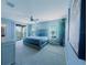 Spacious main bedroom with balcony access, ceiling fan, and neutral decor at 17459 Chateau Pine Way, Clermont, FL 34711