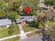 Aerial view of a home with mature tree coverage on a sunny day, indicated with a location marker at 1921 Taylor Ave, Winter Park, FL 32792