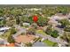 Aerial view showing the neighborhood, highlighting mature trees surrounding the property and adjacent streets at 1921 Taylor Ave, Winter Park, FL 32792