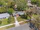 Aerial view of a cozy home nestled among lush trees, highlighting the property's landscaping at 1921 Taylor Ave, Winter Park, FL 32792