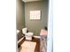 Stylish half bathroom featuring a toilet, vessel sink, and modern decor at 1943 Fountains Dr, Kissimmee, FL 34744