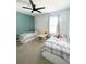 Charming ' bedroom featuring two twin beds, a ceiling fan, and a play table at 1943 Fountains Dr, Kissimmee, FL 34744