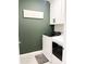 Efficient laundry room with modern, front-load washer and dryer, and stylish wall decor at 1943 Fountains Dr, Kissimmee, FL 34744