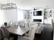 Bright living room featuring a sectional sofa, modern fireplace, built-in shelving, and stylish decor at 1943 Fountains Dr, Kissimmee, FL 34744