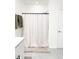 Shower with a curtain, modern fixtures, neutral tones, and an installed shower head at 1943 Fountains Dr, Kissimmee, FL 34744
