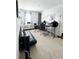 Versatile spare room featuring a comfortable futon and setup for music production or recording at 1943 Fountains Dr, Kissimmee, FL 34744
