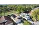 An aerial view displays the home's backyard, landscaping, and patio with partial view of neighborhood golf course at 2316 Paulette Dr, Haines City, FL 33844