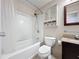 Bathroom featuring a shower-tub combo, vanity with a granite countertop, and tiled floors at 2316 Paulette Dr, Haines City, FL 33844