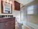 Well-maintained bathroom with modern vanity, tiled shower, and decorative mirror at 2316 Paulette Dr, Haines City, FL 33844