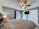 Bright bedroom with tile floors, ceiling fan, and large closets at 2316 Paulette Dr, Haines City, FL 33844