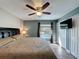 Comfortable bedroom with a view of the pool, television, and plenty of storage at 2316 Paulette Dr, Haines City, FL 33844