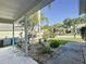 Charming front yard featuring rock landscaping, mature plants, and a view of the neighborhood at 2316 Paulette Dr, Haines City, FL 33844