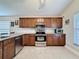 Modern kitchen equipped with stainless steel appliances, granite countertops, and ample cabinet space at 2316 Paulette Dr, Haines City, FL 33844