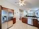 Open kitchen design with granite countertops, stainless steel appliances, and a seamless view into the living room at 2316 Paulette Dr, Haines City, FL 33844