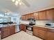 Kitchen boasts granite countertops, stainless steel appliances, ample cabinet space, and open layout to living area at 2316 Paulette Dr, Haines City, FL 33844