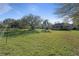 Large lot with mature trees, large lawn and privacy hedges at 2515 Ridgewind Way, Windermere, FL 34786