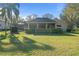 Backyard features beautiful lawn and mature trees at 2515 Ridgewind Way, Windermere, FL 34786